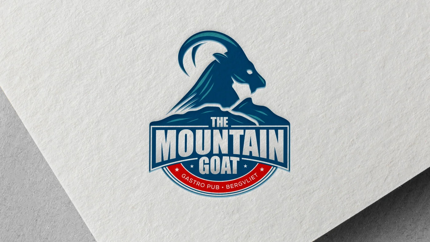 The Mountain Goat logo is presented on a white piece of paper that has a blue border