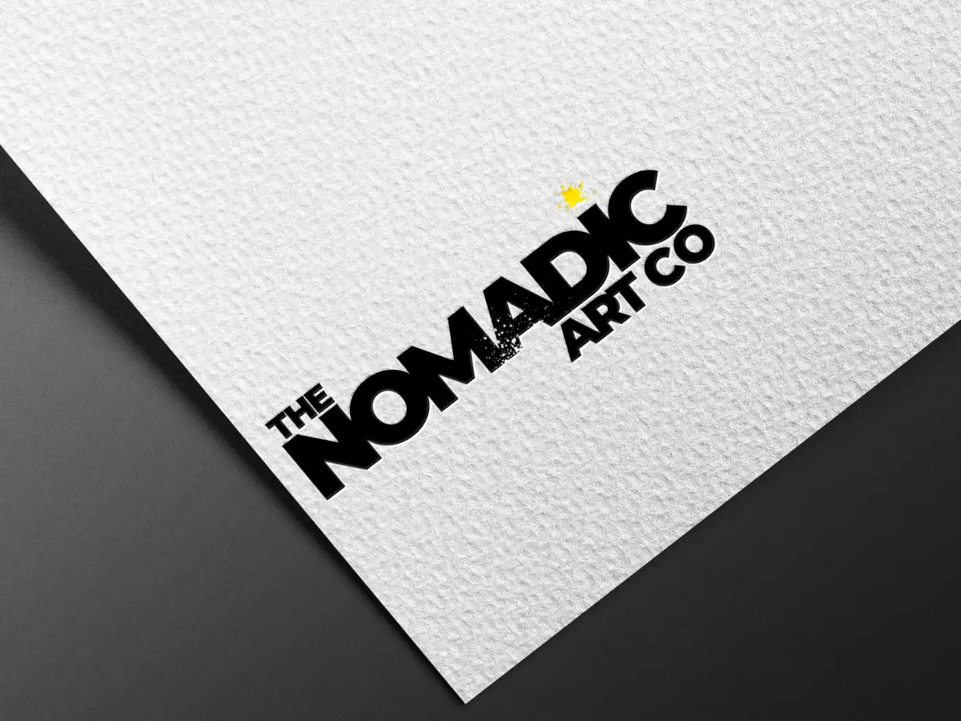 The Nomadic Art Co logo on a white textured paper