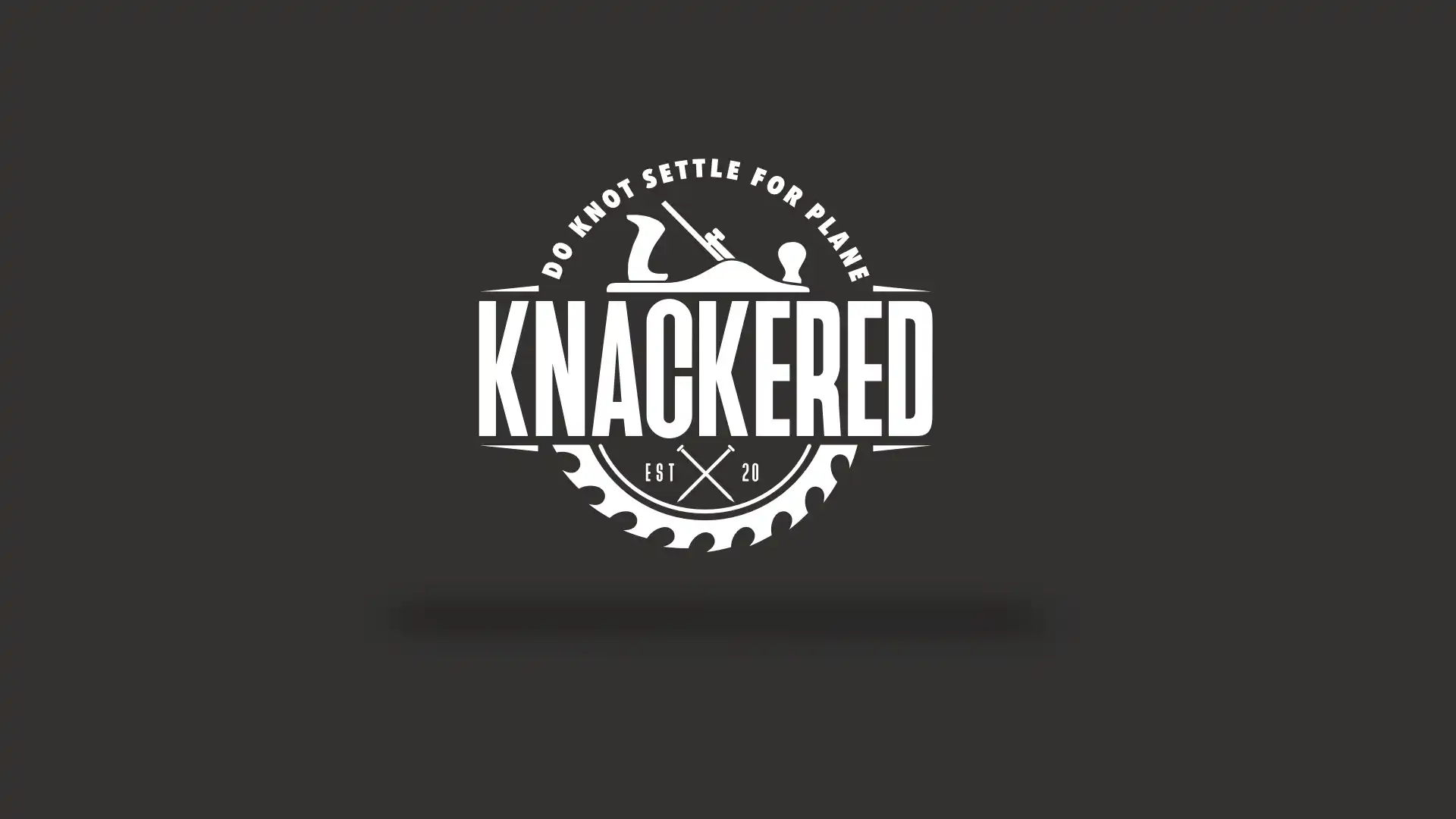 Knackered Carpentry white logo on a dark background