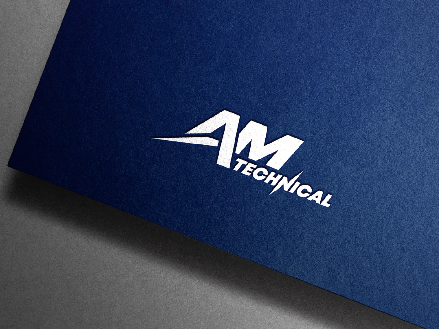 AM Technical logo presented white overlayed on a blue paper background