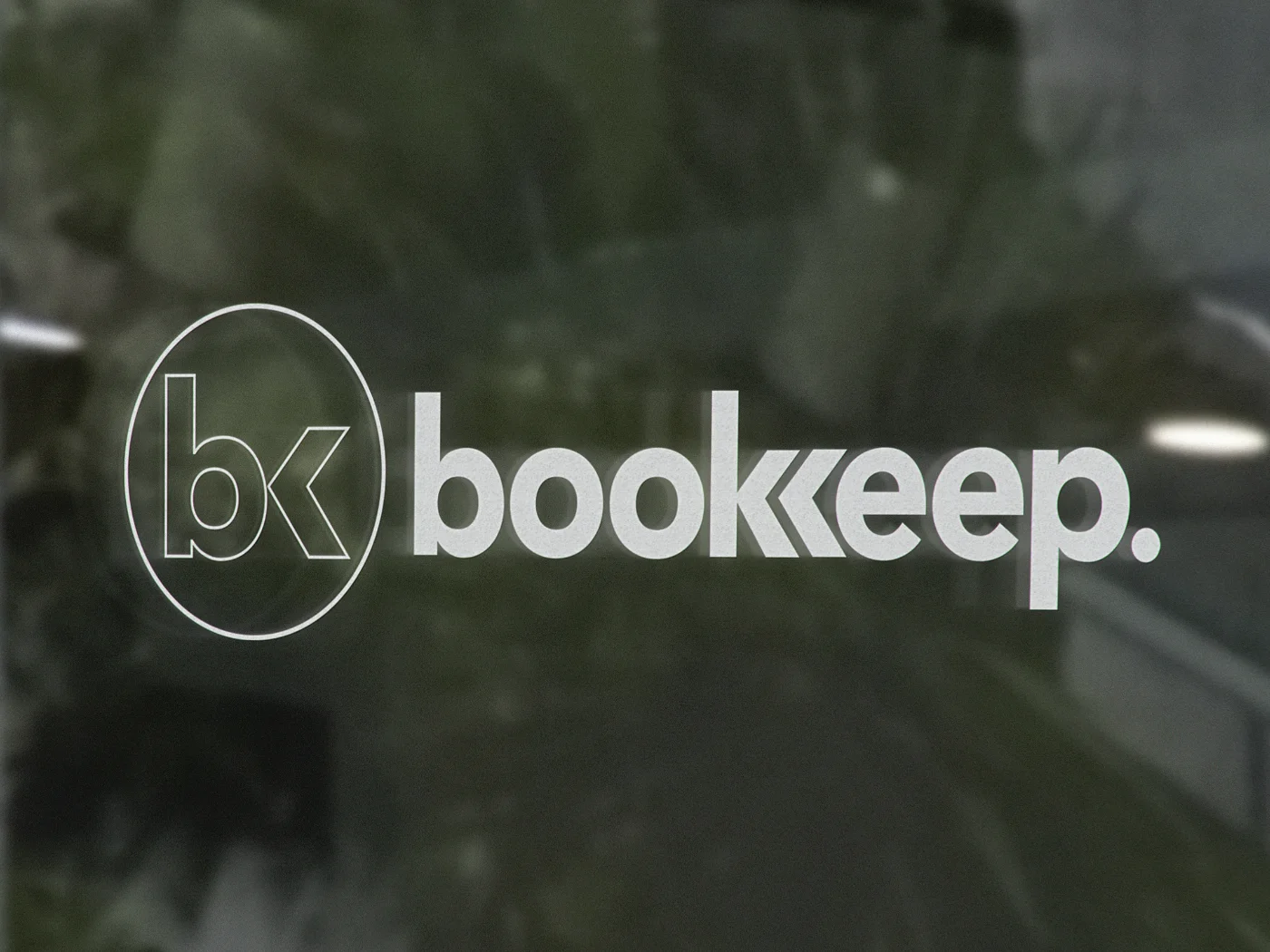 Bookkeep logo on a glass door
